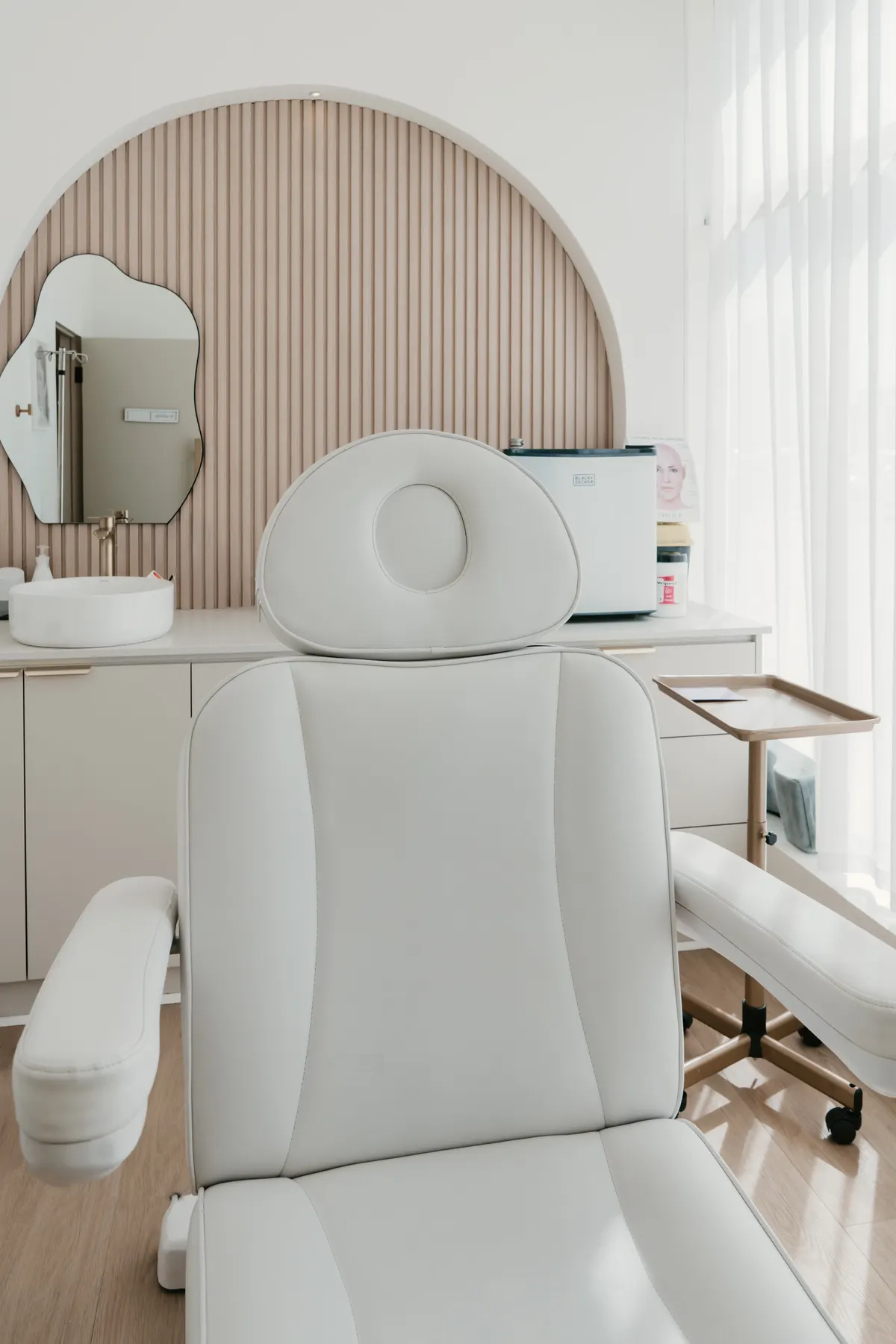 Close view of the padded headrest of a treatment chair in a clinic room